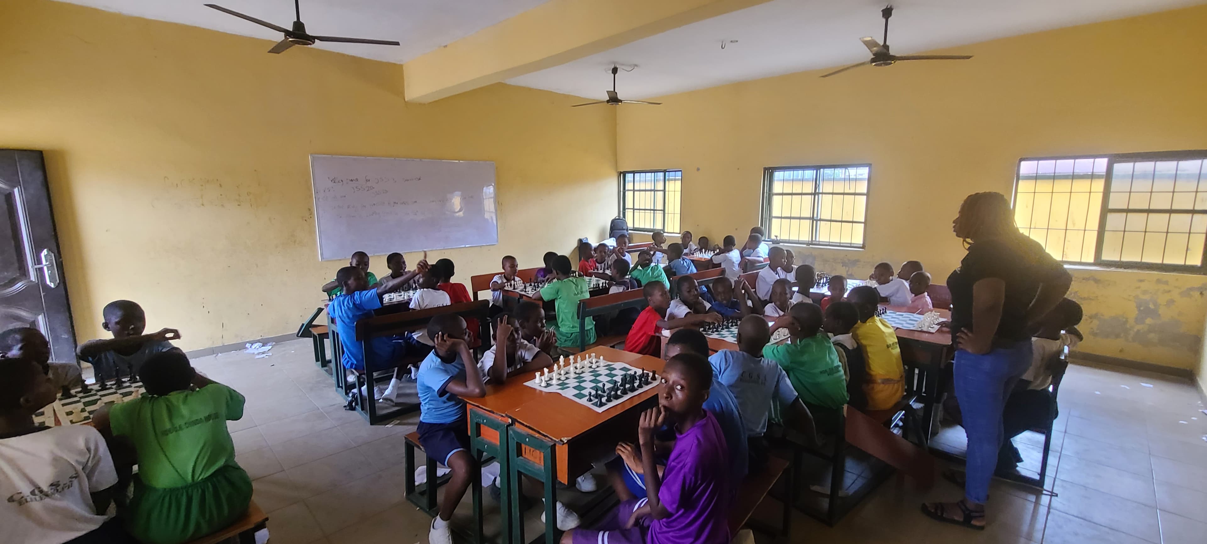 Students practicing chess strategies