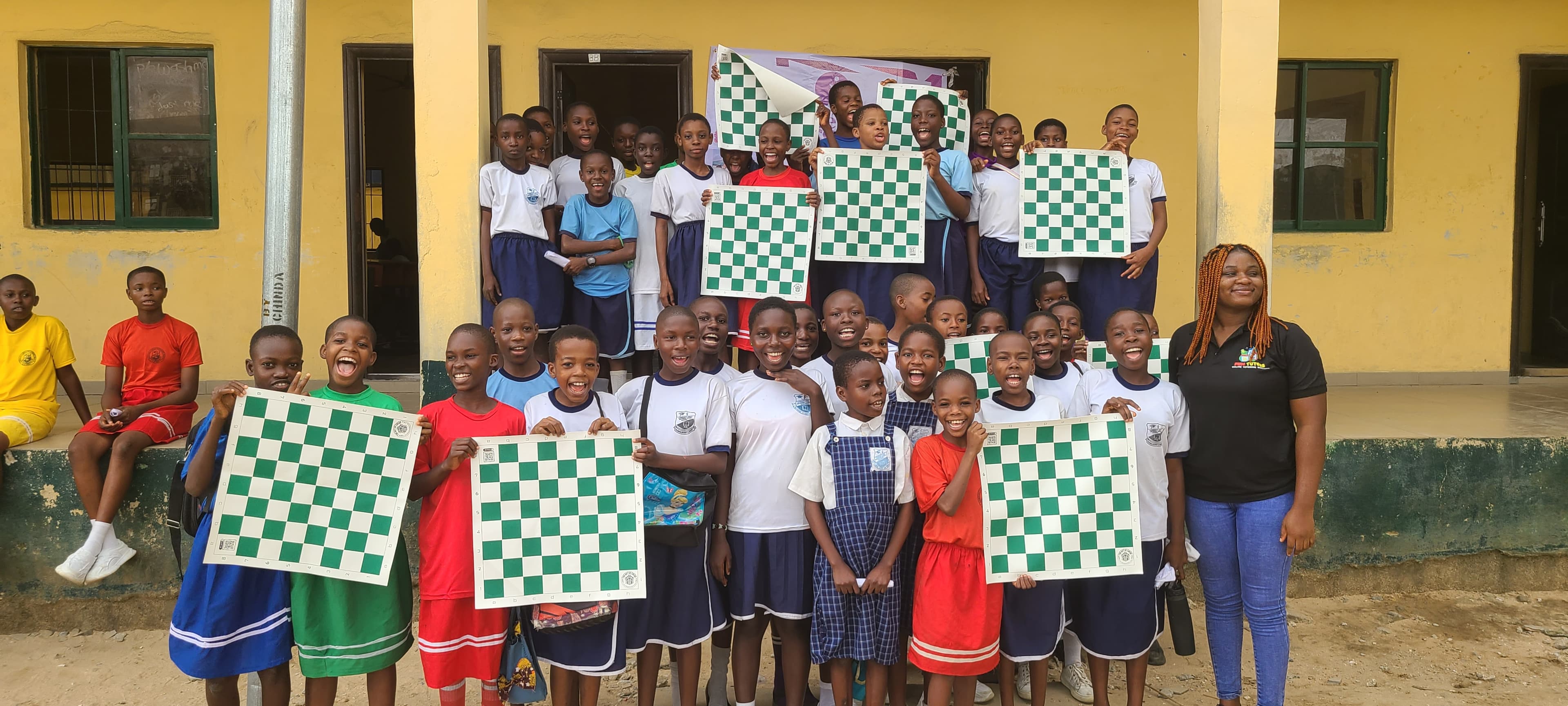 Students practicing chess strategies