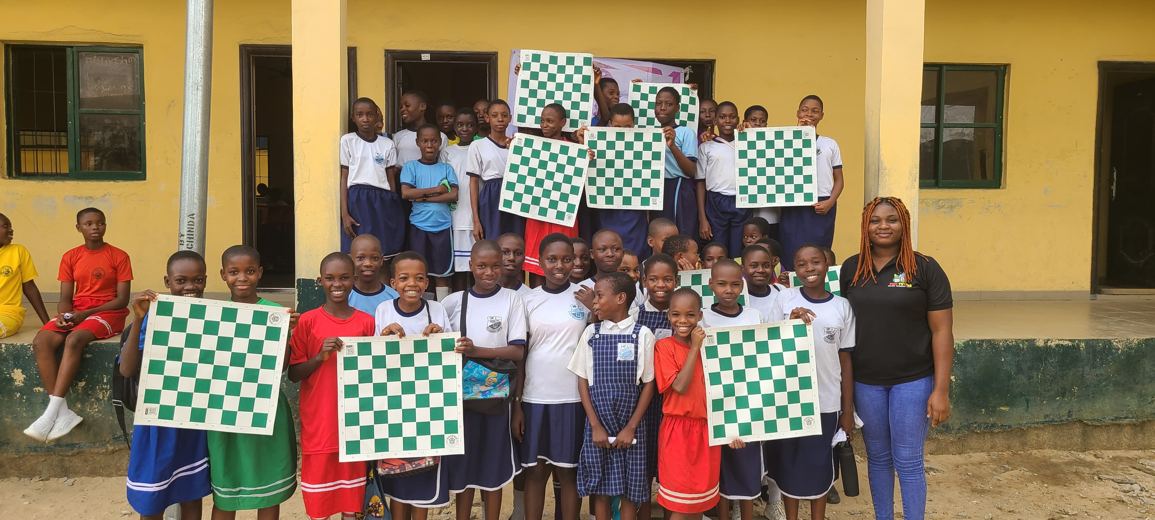 Students practicing chess strategies